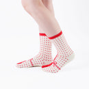 Person wearing long red Tabi Socks " Goen ", right side view