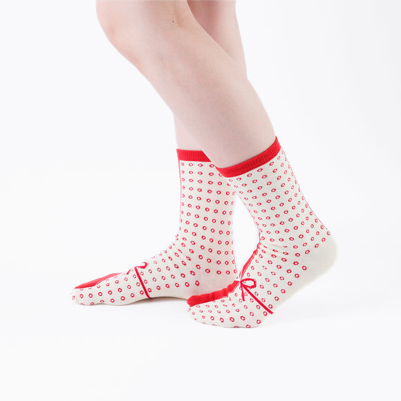 Person wearing long red Tabi Socks " Goen ", right side view