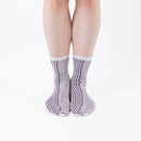Person wearing long purple Tabi Socks " Hyoshigi ", front view