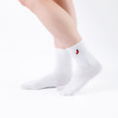 Person wearing long white Tabi Socks "TABI-JI", right side view