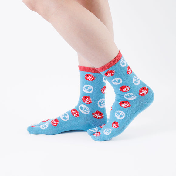 Person wearing long light blue Tabi Socks " Tai ", right side view