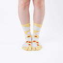 Person wearing long yellow Tabi Socks " Hato ", front view