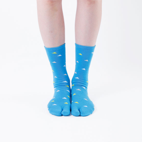 Person wearing long blue Tabi Socks " Surfer ", front view
