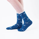 Person wearing long blue Tabi Socks " Shirasu ", right side view