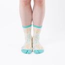 Person wearing long light yellow Tabi Socks " Shika Origami ", front view