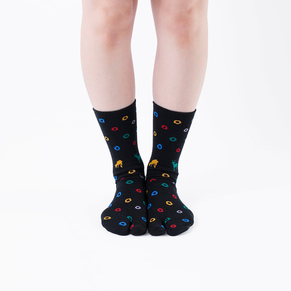 Person wearing long black Tabi Socks " Shika & Wa ", front view