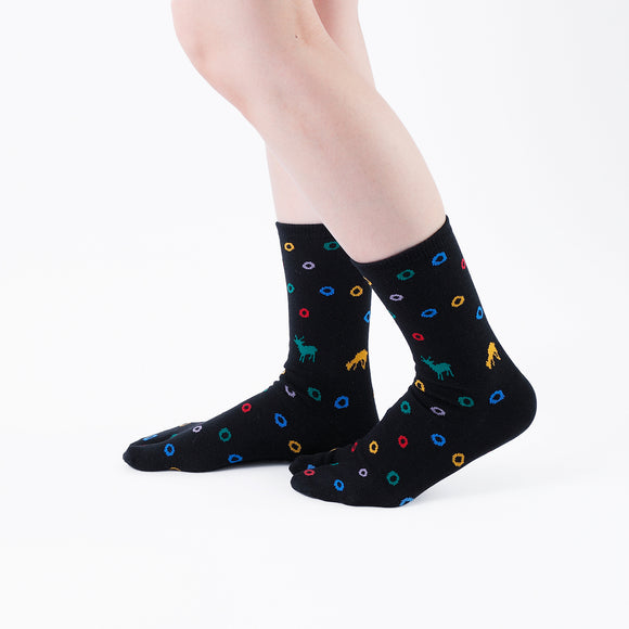 Person wearing long black Tabi Socks " Shika & Wa ", right side view