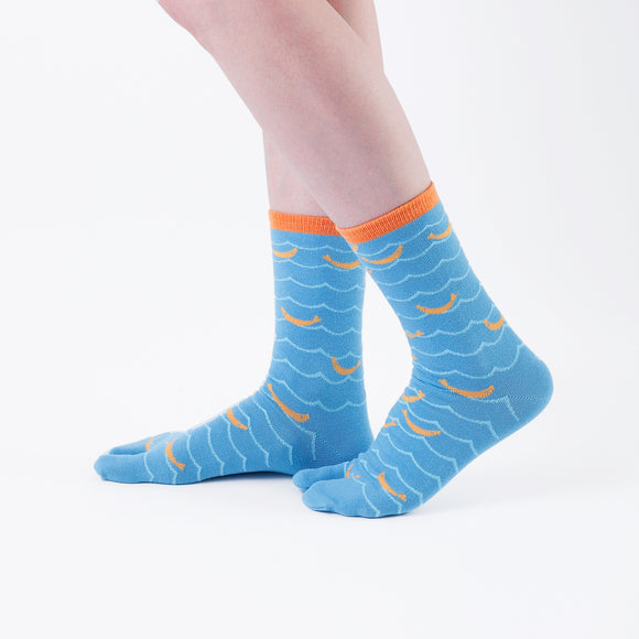 Person wearing long light blue Tabi Socks " Shirasu ", right side view