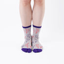 Person wearing long beige Tabi Socks " Shika Origami ", front view