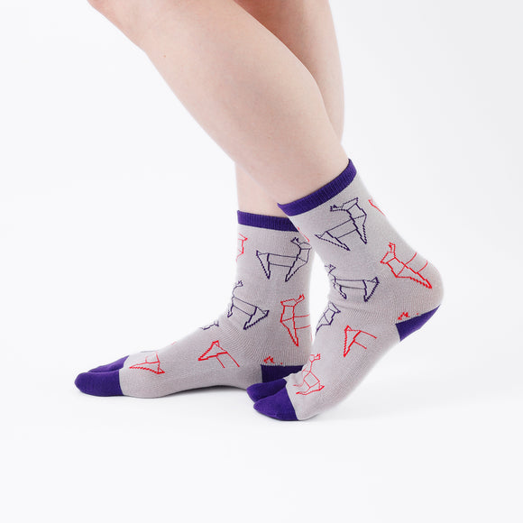 Person wearing long beige Tabi Socks " Shika Origami ", right side view