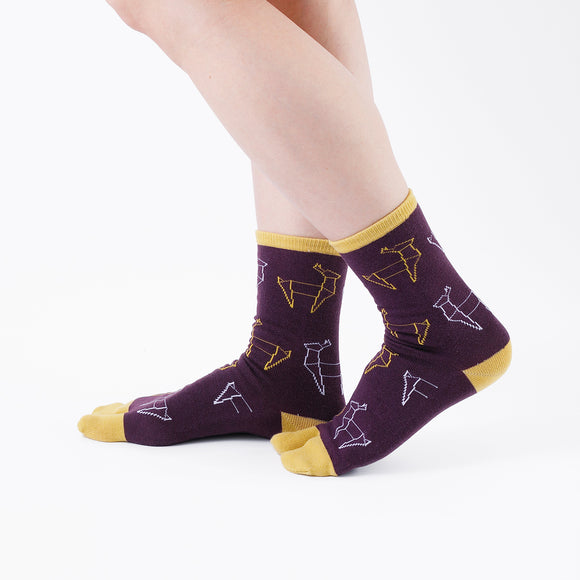 Person wearing long purple Tabi Socks " Shika Origami ", right side view