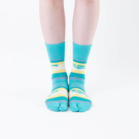 Person wearing long green Tabi Socks " Densha ", front view