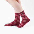 Person wearing long dark red Tabi Socks " Shika Nozoku ", right side view