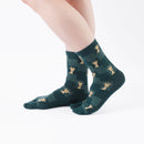 Person wearing long green Tabi Socks " Shika Nozoku ", right side view