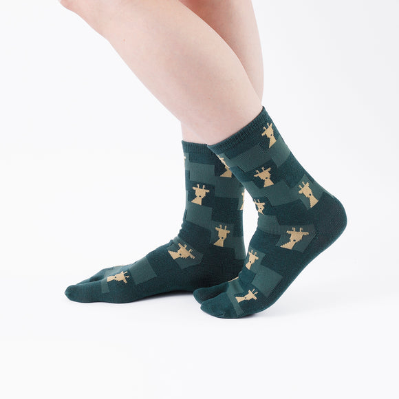 Person wearing long green Tabi Socks " Shika Nozoku ", right side view