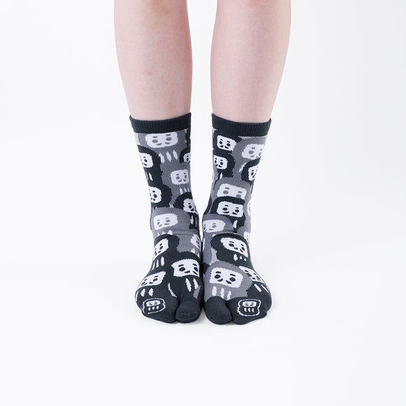 Person wearing long black Tabi Socks " Daruma ", front view