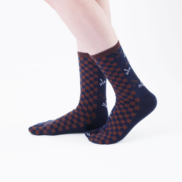 Person wearing long navy Tabi Socks " Tonbo & Ichimatsu ", right side view