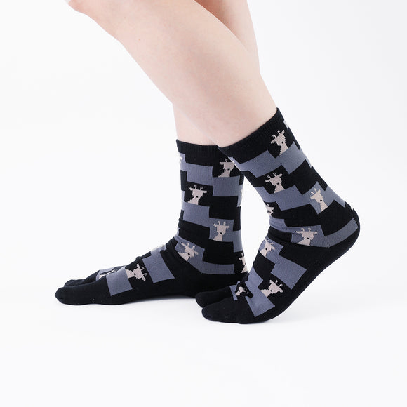 Person wearing long black Tabi Socks " Shika Nozoku ", right side view