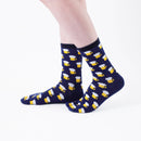 Person wearing long navy Tabi Socks " Beer ", right side view