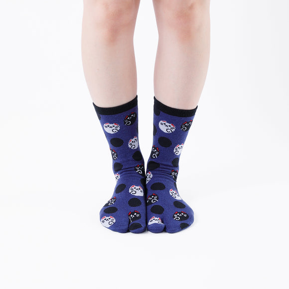 Person wearing long navy Tabi Socks " Maneki Neko ", front view