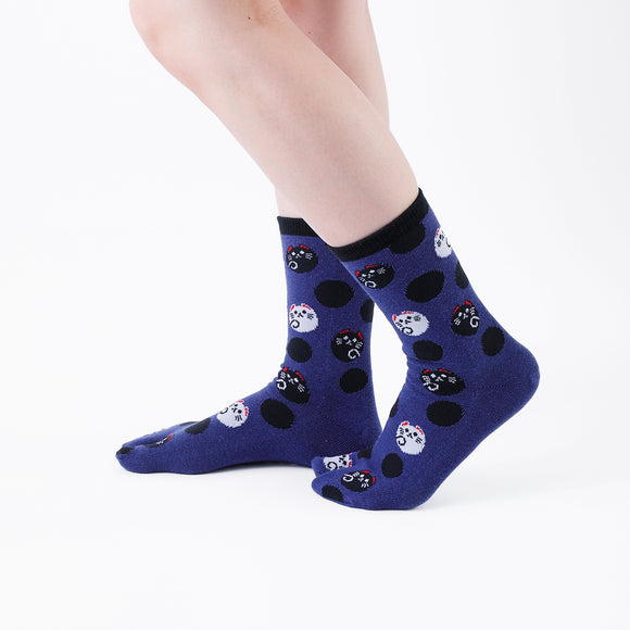 Person wearing long navy Tabi Socks " Maneki Neko ", right side view