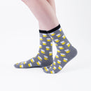 Person wearing long gray Tabi Socks " Beer ", right side view