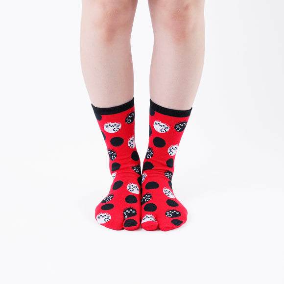 Person wearing long red Tabi Socks " Maneki Neko ", front view