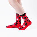 Person wearing long red Tabi Socks " Maneki Neko ", right side view