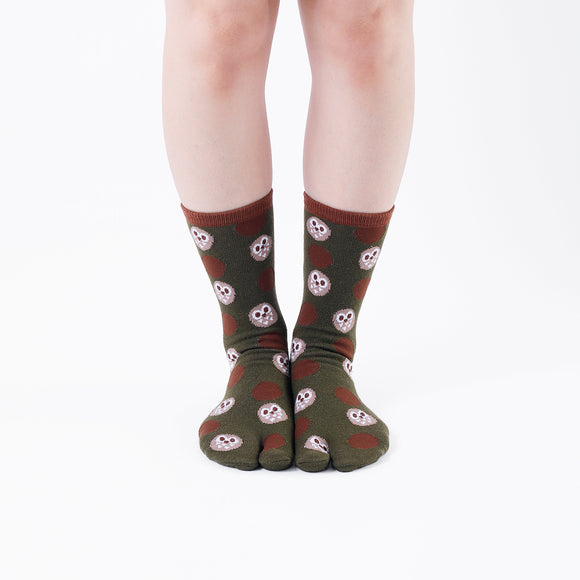 Person wearing long dark green Tabi Socks " Fukuro ", front view