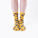 Person wearing long yellow Tabi Socks " Chigiri-e ", front view