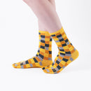 Person wearing long yellow Tabi Socks " Chigiri-e ", front view