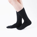 Person wearing black Tabi Socks "NOBI NOBI", right side view